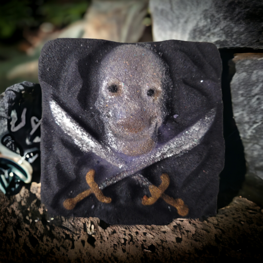 Cursed Pirate Bath Bomb that looks like a skull over crossed swords by The Blue Pelican Bath & Body