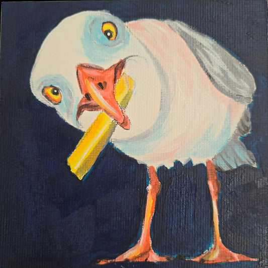 A hand-painted seagull holding a french fry, on a finished canvas, made with paint and instructions contained in the kit.